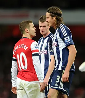 Arsenal's Jack Wilshere Faces Off Against West Brom's Jonas Olsson and Chris Brunt during the 2012-13 Premier League Match