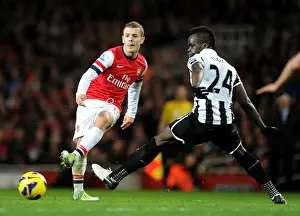Arsenal's Jack Wilshere Fends Off Newcastle's Cheick Tiote: A Battle in the Midfield, December 2012