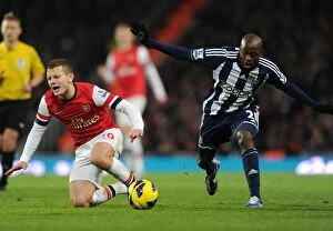 Images Dated 8th December 2012: Arsenal's Jack Wilshere Fouls Youssouf Mulumbu in Premier League Clash (2012-13)