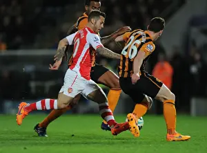 Hull City V Arsenal 2014/15 Prints: Arsenal's Jack Wilshere Goes Head-to-Head with Huddlestone and Robertson in Intense Premier League Showdown