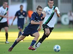 Images Dated 27th July 2009: Arsenal's Jack Wilshere Overpowers Szombathelyi's Bence Iszlia in 5-0 Pre-Season Victory, 2009