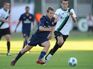Arsenal's Jack Wilshere Overpowers Szombathelyi's Bence Iszlia in 5-0 Pre-Season Victory, 2009