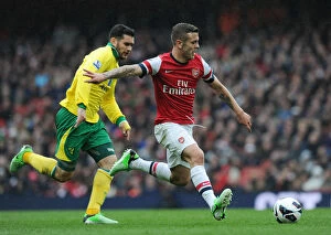 Images Dated 13th April 2013: Arsenal's Jack Wilshere Scores Past Norwich's Bradley Johnson - Arsenal vs Norwich City