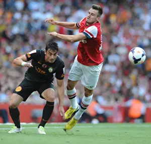 Arsenal V Galatasaray 2013-14 Prints: Arsenal's Jenkinson Faces Off Against Riera as Galatasaray Takes Emirates Cup Lead