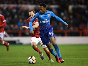 Nottingham Forest V Arsenal FA Cup 3rd Round 2017-18 Prints: Arsenal's Joe Willock Brushes Past Nottingham Forest's David Vaughan in FA Cup Clash