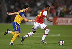 Arsenal's Joe Willock Clashes with Colorado Rapids Jordan Schweitzer in 2019 Pre-Season Match