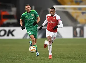 FC Vorskla Poltava V Arsenal 2018-19 Prints: Arsenal's Joe Willock Clashes with Vyacheslav Sharpar in Europa League Battle