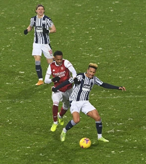 West Bromwich Albion v Arsenal 2020-21 Collection: Arsenal's Joe Willock Clashes with West Bromwich Albion's Callum Robinson in Premier League Showdown