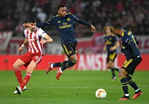 Olympiacos V Arsenal 2019-20 Prints: Arsenal's Joe Willock Dodges Olympiacos Andreas Bouchalakis in Europa League Clash