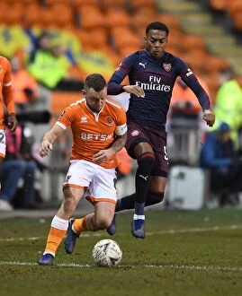 Images Dated 5th January 2019: Arsenal's Joe Willock Faces Off Against Blackpool's Jay Spearing in FA Cup Clash