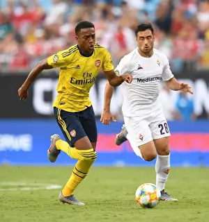 Arsenal's Joe Willock Faces Off Against Fiorentina's Jaime Baez in International Champions Cup Clash