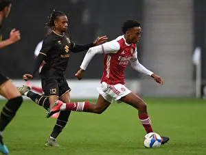 Arsenal's Joe Willock Faces Off Against MK Dons David Kasumu in 2020-21 Pre-Season Friendly
