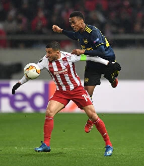 Olympiacos v Arsenal 2019-20 Collection: Arsenal's Joe Willock Faces Off Against Olympiacos Omar Elabdellaoui in Europa League Clash