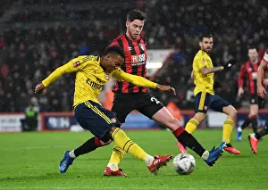Arsenal's Joe Willock Faces Pressure from Bournemouth's Jack Simpson in FA Cup Clash