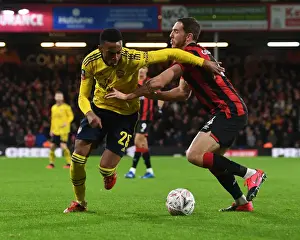 AFC Bournemouth V Arsenal - FA Cup 4th Rd 2020 Prints: Arsenal's Joe Willock Fends Off Bournemouth's Dan Gosling in FA Cup Clash