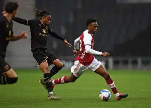 Arsenal's Joe Willock Goes Head-to-Head with MK Dons David Kasumu in Pre-Season Clash