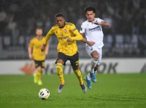 Arsenal's Joe Willock Goes Head-to-Head with Vitoria's Lucas Evangelista in Europa League Showdown