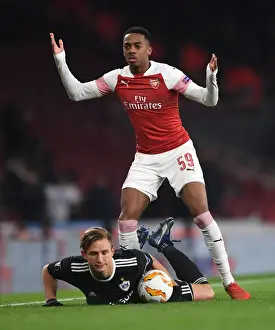 Arsenal V Qarabag 2018-19 Prints: Arsenal's Joe Willock Intimidates Qarabag's Jakub Rzezniczak in Europa League Clash