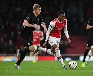 Arsenal's Joe Willock Outmaneuvers Eintracht Frankfurt's Martin Hinteregger in Europa League Clash