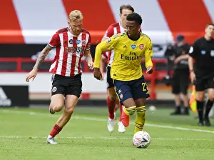 Sheffield United V Arsenal - FA Cup 2019-20 Prints: Arsenal's Joe Willock Outmaneuvers Sheffield United's Olivier McBurnie in FA Cup Quarterfinal