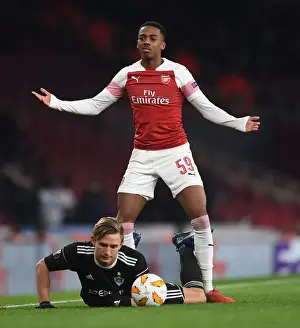 Arsenal V Qarabag 2018-19 Prints: Arsenal's Joe Willock Stares Down Qarabag's Jakub Rzezniczak in Europa League Clash