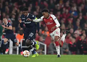 Arsenal V Red Star Belgrade 2017-18 Prints: Arsenal's Joe Willock vs. Mitchell Donald: A Europa League Battle