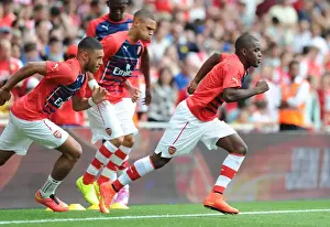 Arsenal V Benfica 2014-15 Prints: Arsenal's Joel Campbell Faces Off Against Benfica at the Emirates Cup