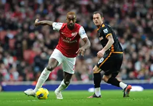 Arsenal V Wolverhampton Wanderers 2011-2012 Prints: Arsenal's Johan Djourou Breaks Past Wolves Steven Fletcher during the 2011-2012 Premier League Clash