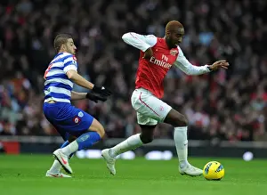 Arsenal V Queens Park Rangers 2011-12 Prints: Arsenal's Johan Djourou Outmaneuvers QPR's Adel Taarabt during Premier League Clash