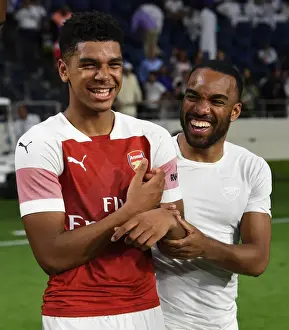 Al-Nasr Dubai SC V Arsenal 2018-19 Prints: Arsenal's John-Jules and Lacazette Celebrate after Al-Nasr Friendly Win