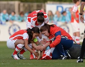 Chelsea Ladies v Arsenal Ladies 30/4/15 Collection: Arsenal's Jordan Nobbs Consoled by Teammates After Suffering Injury vs. Chelsea Ladies