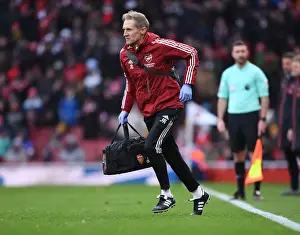 Arsenal's Jordan Reece Attends to Injured Player in Intense Arsenal vs Newcastle United Clash (2021-22)