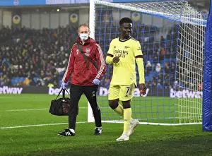 Arsenal's Jordan Reece Tends to Injured Bukayo Saka during Brighton vs Arsenal (2021-22)