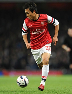 Arsenal V Chelsea - Capital One Cup 4th Rd 2013-14 Prints: Arsenal's Ju Young Park Faces Off Against Chelsea in Capital One Cup