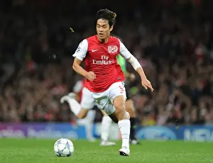 Arsenal V Marseille 2011-12 Prints: Arsenal's Ju Young Park Goes Head-to-Head with Olympique de Marseille in the UEFA Champions League