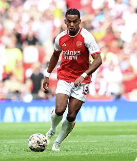 Arsenal's Jurrien Timber Chases the Ball in FA Community Shield Clash Against Manchester City, 2023-24