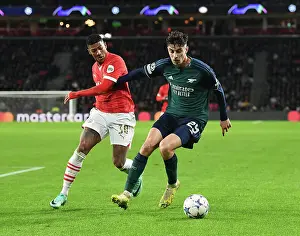 PSV Eindoven V Arsenal 2023-24 Prints: Arsenal's Kai Havertz Faces Off Against PSV's Patrick van Aanholt in Champions League Clash