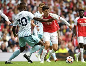 Arsenal's Kai Havertz Fends Off Nottingham Forest's Willy Boly in 2023-24 Premier League Clash