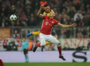Images Dated 15th February 2017: Arsenal's Kieran Gibbs Faces Off Against Bayern Munich's Arjen Robben in Champions League Clash