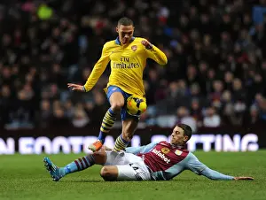 Arsenal's Kieran Gibbs Faces Pressure from Aston Villa's Matthew Lowton in Premier League Clash