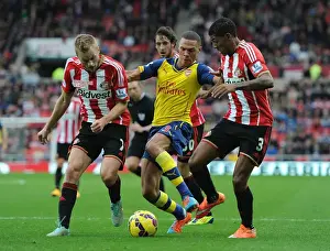 Arsenal's Kieran Gibbs Outmaneuvers Larsson and van Aanholt during Sunderland Clash