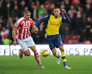 Stoke City V Arsenal 2014-15 Prints: Arsenal's Kieran Gibbs Outmaneuvers Stoke's Jonathan Walters