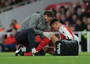 Arsenal V West Bromwich Albion 2016-17 Prints: Arsenal's Kieran Gibbs Receives Treatment from Physio Colin Lewin during Arsenal v West Bromwich Albion Match