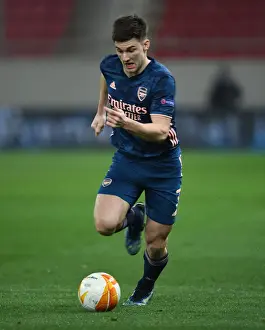 Olympiacos V Arsenal 2020-21 Prints: Arsenal's Kieran Tierney in Action at Empty Olympiacos Stadium - UEFA Europa League Round of 16