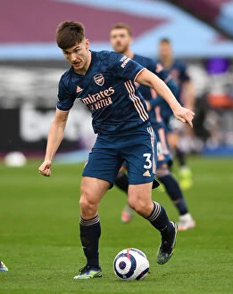 Images Dated 21st March 2021: Arsenal's Kieran Tierney in Action during Premier League Clash against West Ham United