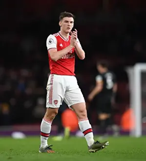 Arsenal's Kieran Tierney Celebrates with Fans after Victory over Brighton & Hove Albion