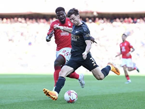 Images Dated 20th May 2023: Arsenal's Kieran Tierney Clashes with Nottingham Forest's Serge Aurier in Premier League Showdown