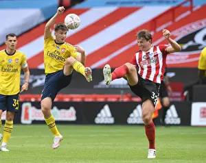 Arsenal's Kieran Tierney Clashes with Sheffield United's Sander Berge in FA Cup Quarterfinal