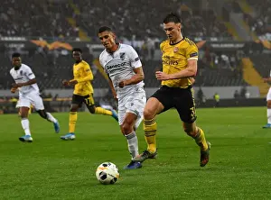 Arsenal's Kieran Tierney Clashes with Vitoria Guimaraes Victor Garcia in Europa League Match
