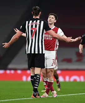 Arsenal's Kieran Tierney Confronts Newcastle's Andy Carroll During FA Cup Clash
